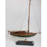 •WILLIAM CROSBIE RSA, RGI (SCOTTISH 1915-1999) MODEL OF A YACHT MOUNTED ON WOODEN PLINTH Wood, 126cm