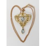 A 9CT GOLD EDWARDIAN AQUAMARINE AND PEARL PENDANT BROOCH of classic design dimensions 4.5cm x 3.2cm,