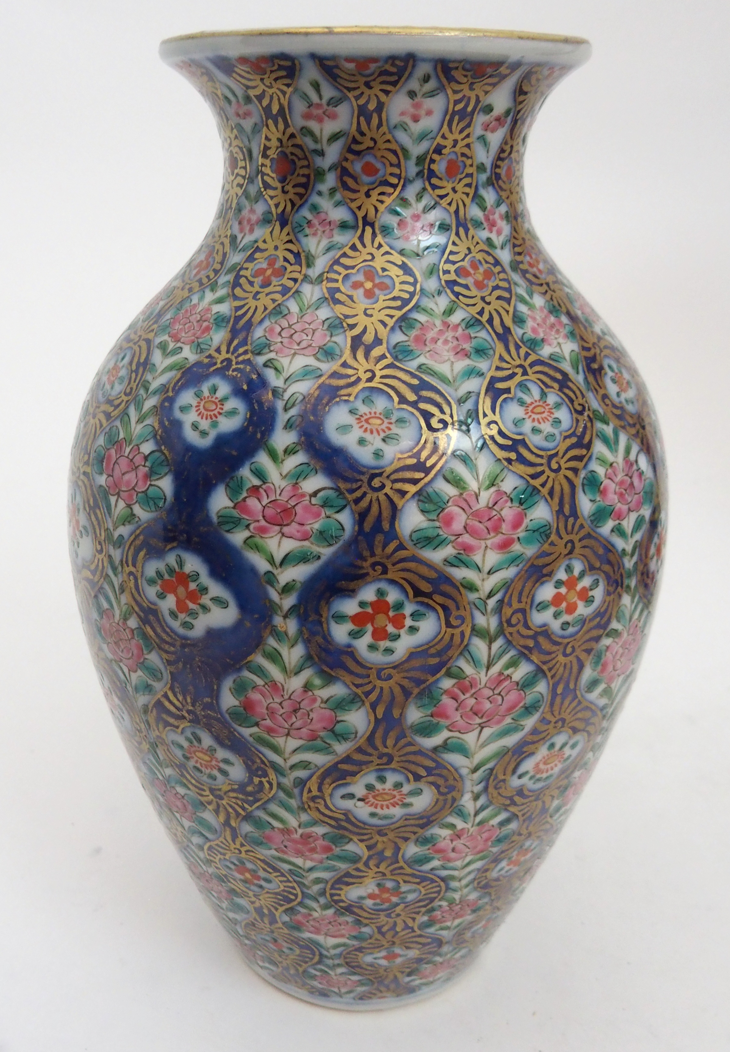 AN IMARI BOTTLE SHAPED VASE painted with figures in gardens surrounded by foliage and detailed in - Image 2 of 11