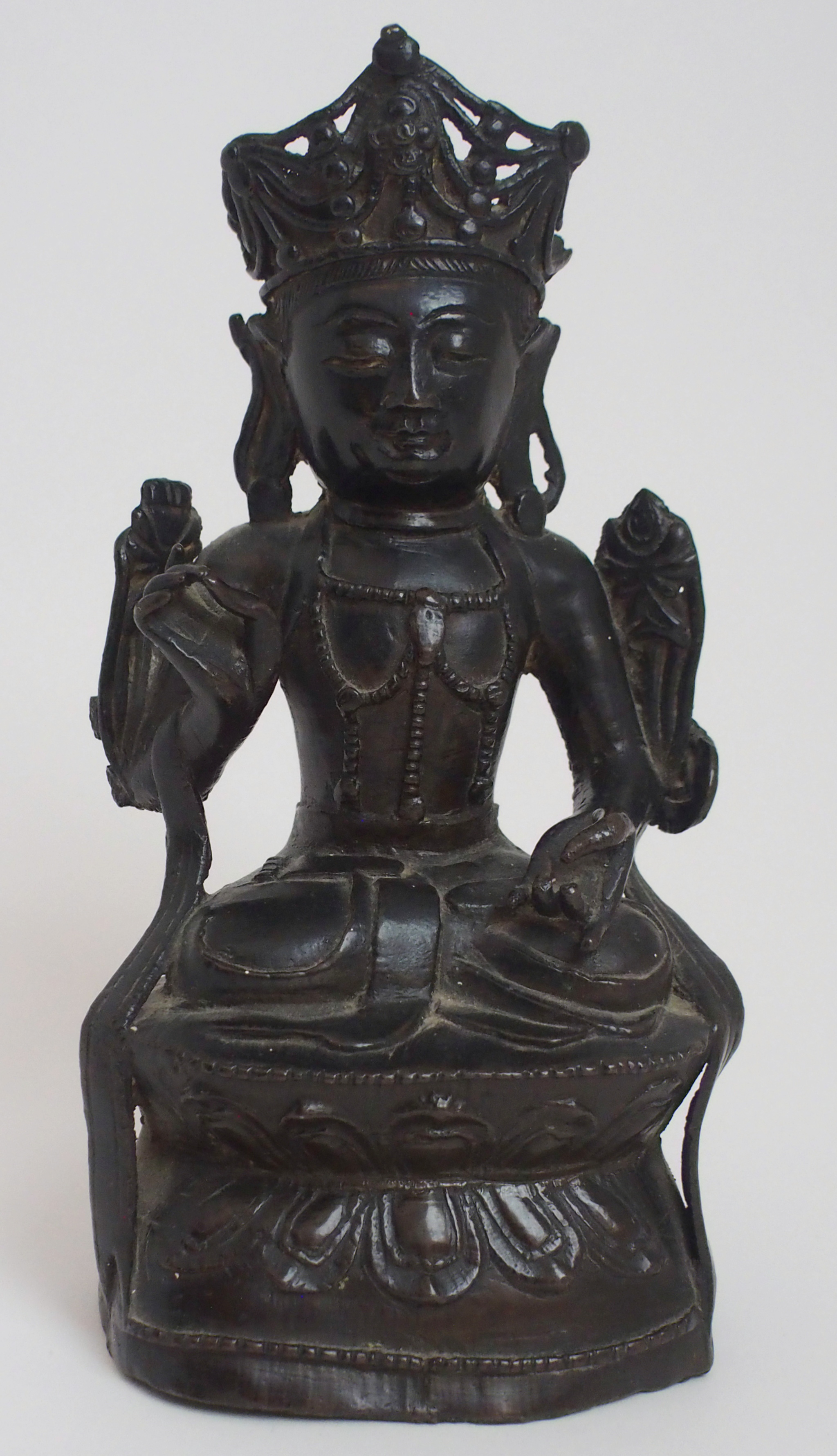 A CHINESE BRONZE BUDDHAVISTA seated on a lotus throne with hands in symbolic pose, 20cm high