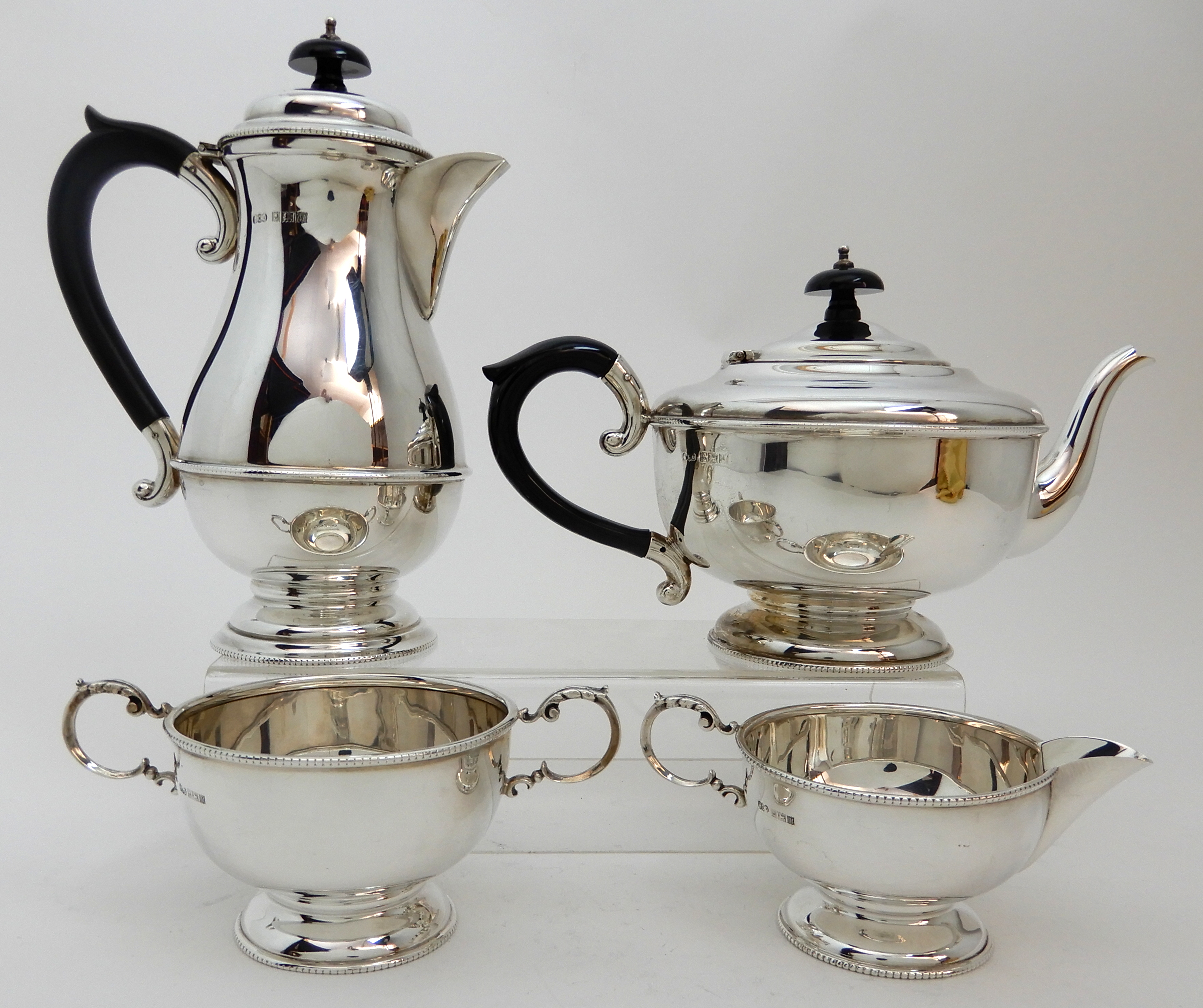 A FOUR PIECE SILVER TEA SERVICE by Henry Clifford Davis, Birmingham 1961, of plain baluster form