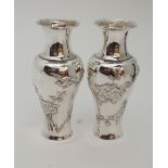A PAIR OF CHINESE SILVER BALUSTER VASES decorated with birds amongst flowering branches, stamped