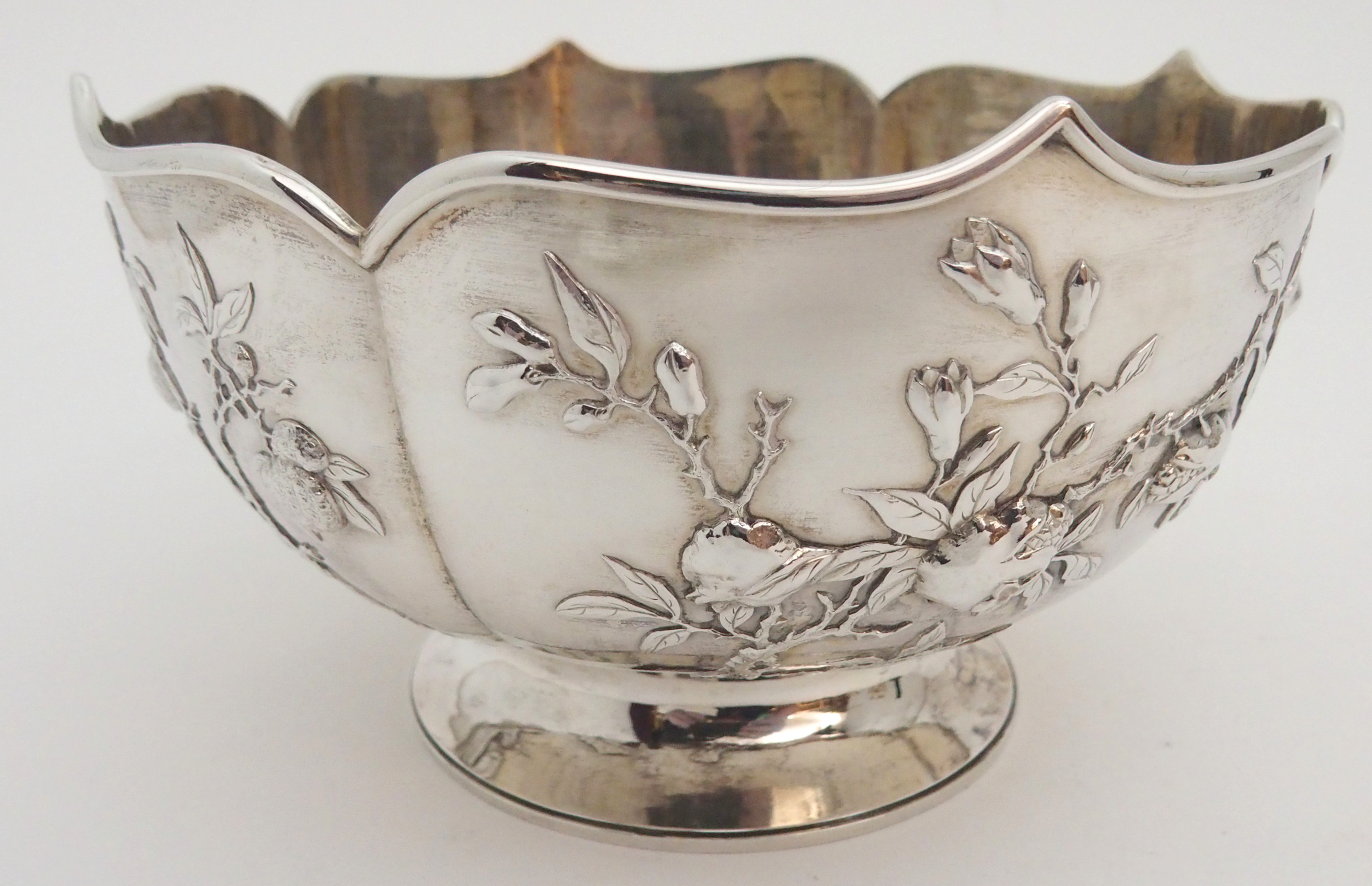 A CHINESE SILVER LOBED BOWL decorated with panels of fruit, beneath a folded rim and stamped, ZEEWO - Image 4 of 6