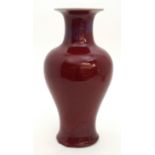 A CHINESE SANG DE BOEUF BALUSTER VASE with running lilac glaze to neck, 36cm high Condition