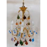 A MURANO GLASS CHANDELIER the gilt metal five branch frame hung with coloured glass fruits and