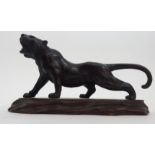 A JAPANESE BRONZE MODEL OF A TIGER prowling on all fours, signed, 11.5cm high and 24cm long, wood