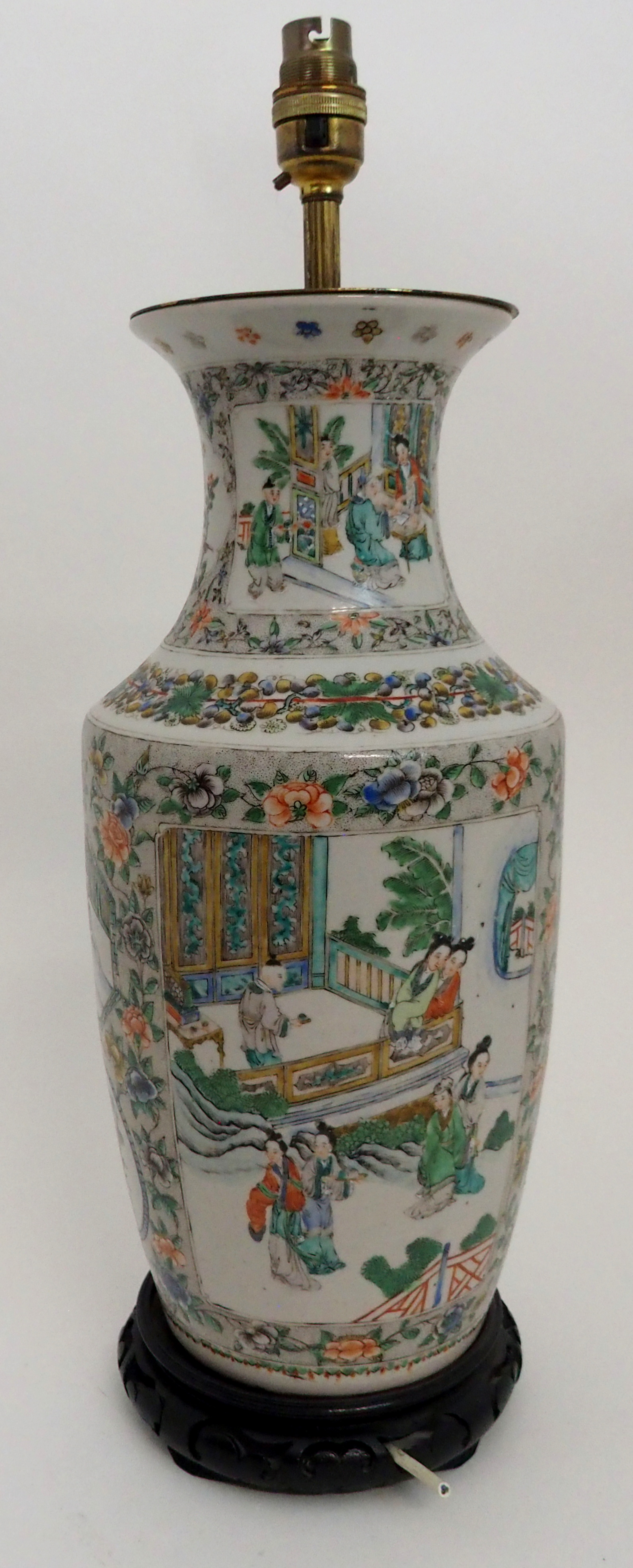 A CHINESE FAMILLE VERTE BALUSTER VASE painted with panels of courtiers in garden palaces within