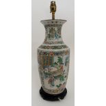 A CHINESE FAMILLE VERTE BALUSTER VASE painted with panels of courtiers in garden palaces within