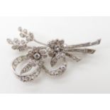 A WHITE METAL FLORAL SPRAY BROOCH set with estimated approx 1ct of diamonds, dimensions 4.6cm x 2.