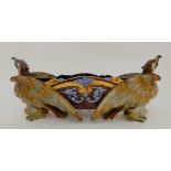 A GINORI MAJOLICA CENTREPIECE modelled with two eagles supporting the bowl, 53cm long Condition