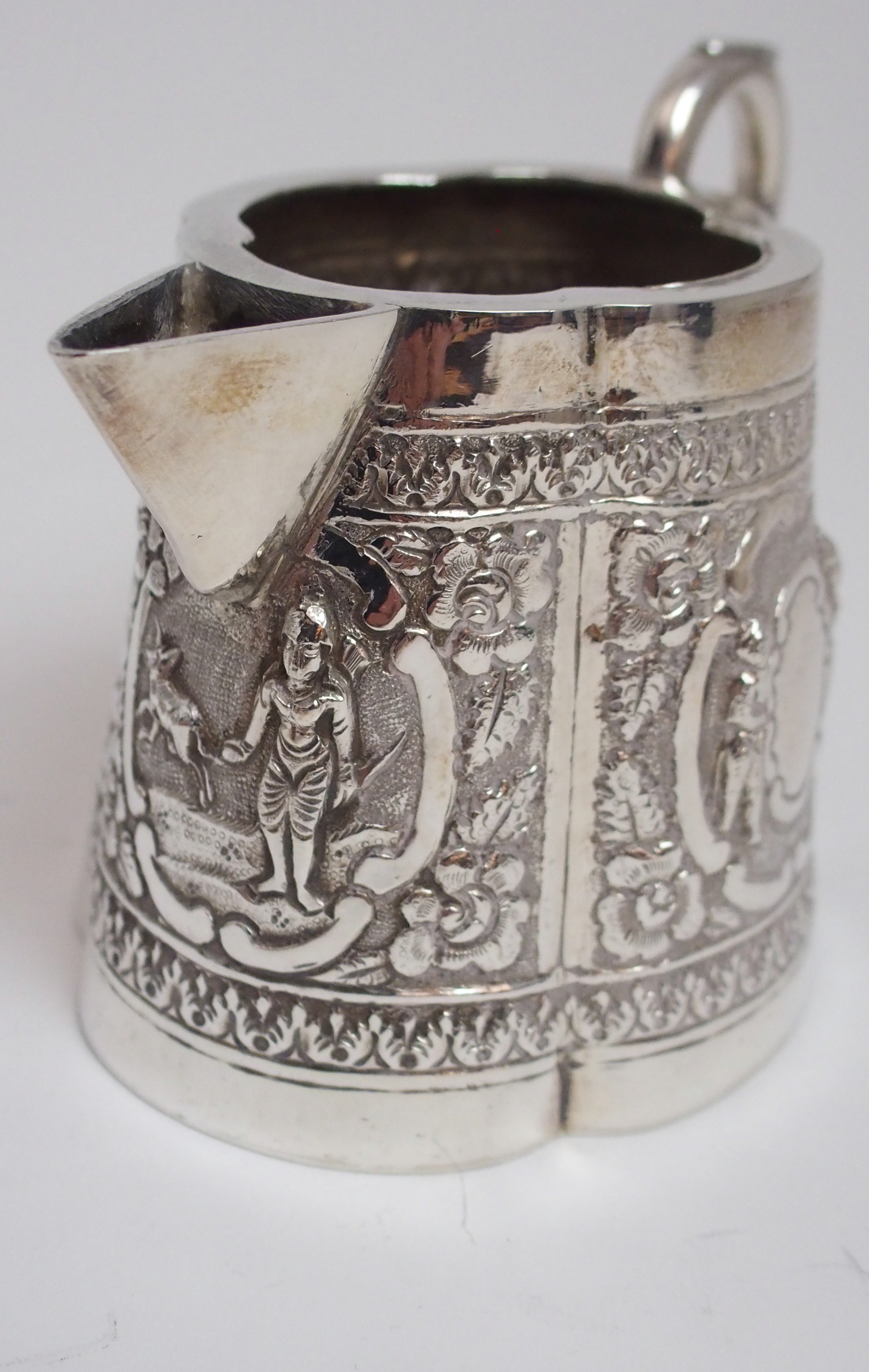 AN ASIAN WHITE METAL THREE PIECE TEA SERVICE cast and decorated with figures in cartouche panels - Image 13 of 13