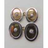 A PAIR OF 18C YELLOW AND WHITE GOLD CUFFLINKS SET WITH DIAMONDS approx dimensions 1.8cm x 1.4cm,