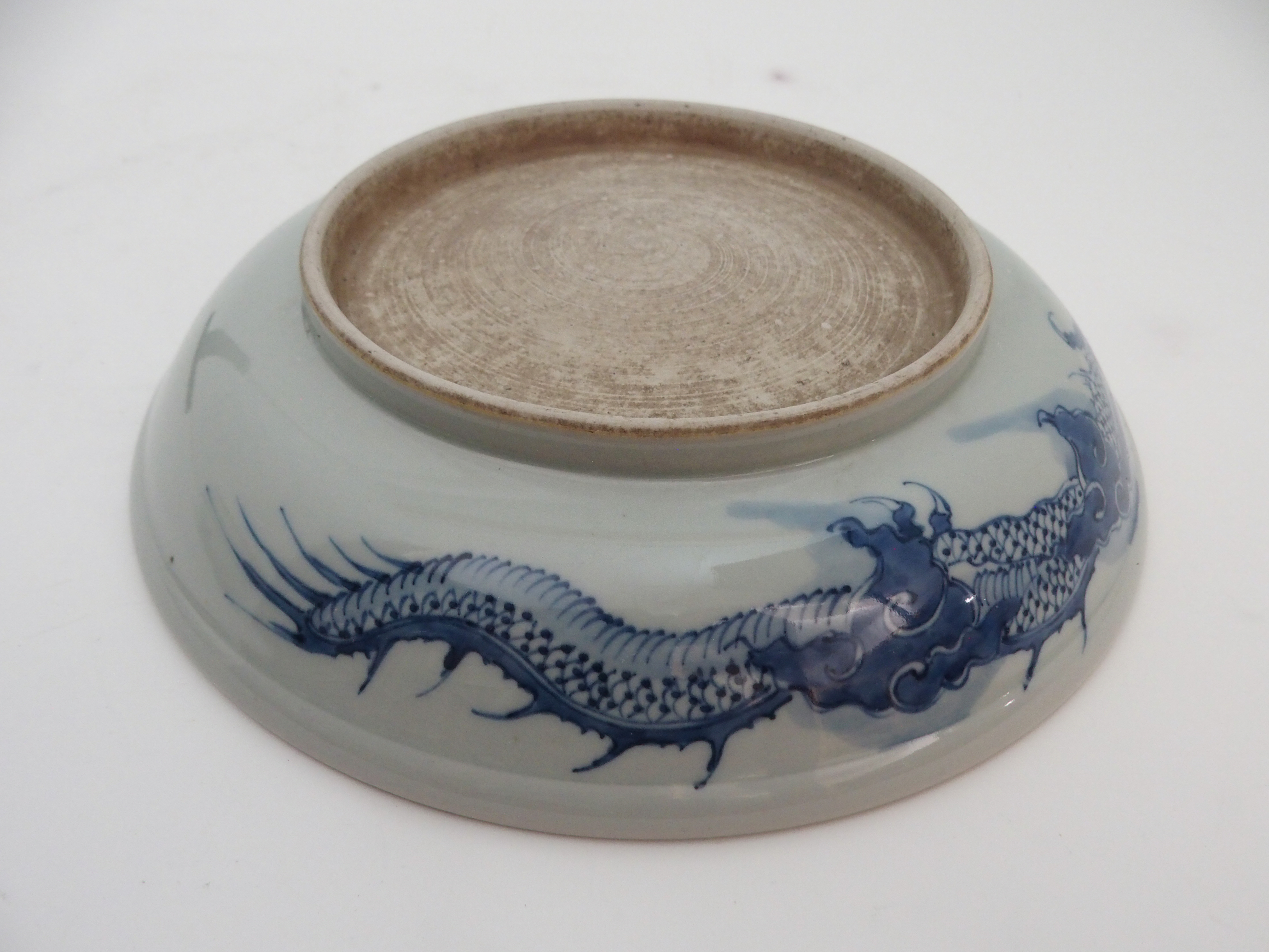 A CHINESE BLUE AND WHITE DISH painted with a dragon chasing the pearl of wisdom, 28cm diameter and - Image 8 of 9