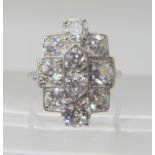 A WHITE METAL DIAMOND PLAQUE RING set with estimated approx 2.11cts of diamonds to the classic