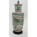 A CANTON FAMILLE ROSE BALUSTER VASE painted with panels of birds and butterflies amongst foliage