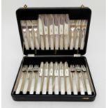 A CASED 24-PIECE SILVER AND MOTHER OF PEARL DESSERT CUTLERY SET by Emile Viner, Sheffield 1933