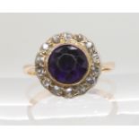 A 9CT GOLD AMETHYST AND DIAMOND CLUSTER RING the amethyst is in a Victorian style closed back