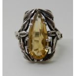A SILVER CITRINE SET RING IN THE STYLE OF BERNARD INSTONE the peardrop shape citrine is set within a