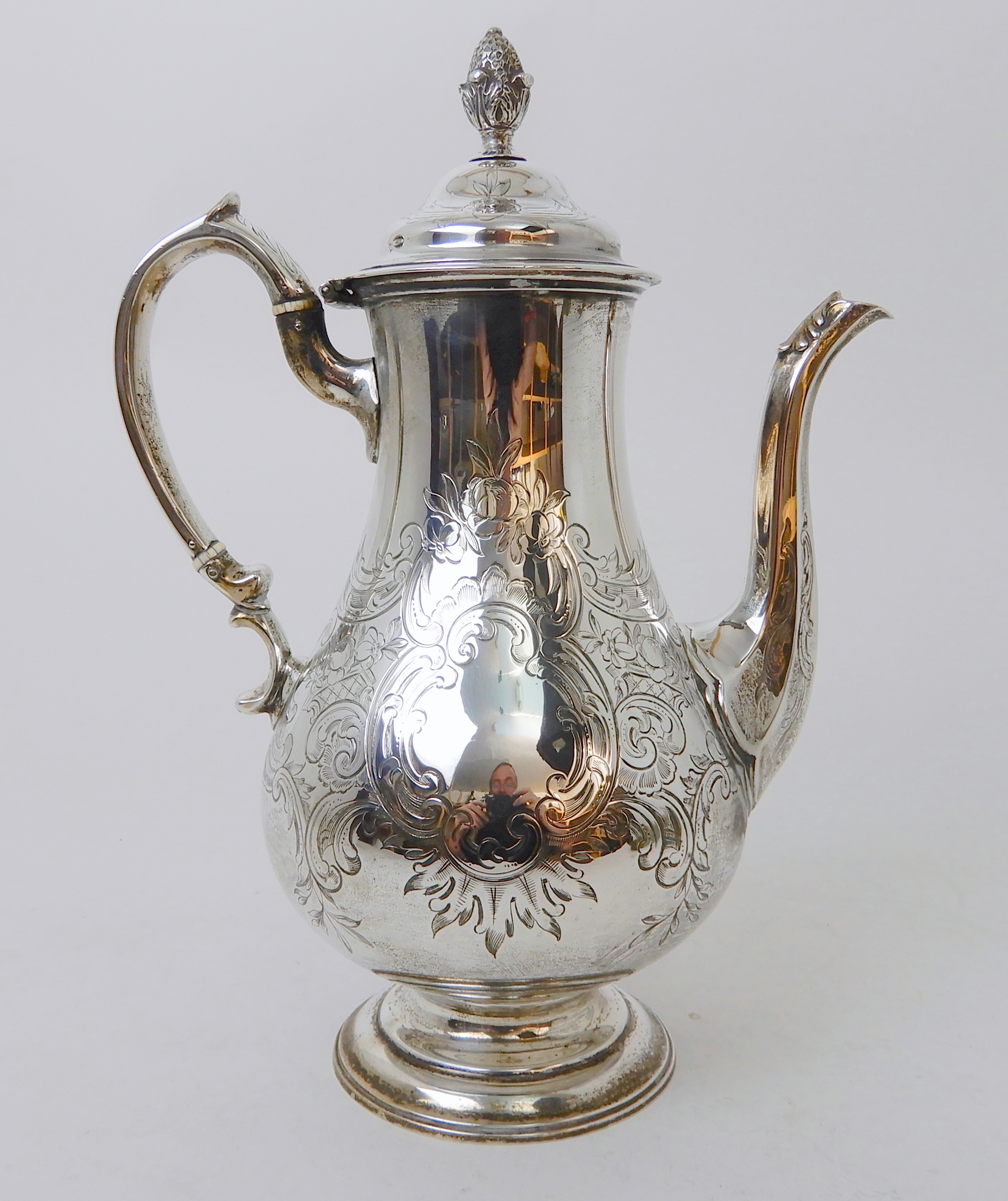 A VICTORIAN SILVER COFFEE POT probably by William Hunter, London 1842, of baluster shape with