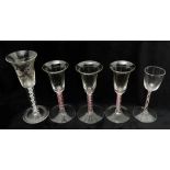A GROUP OF FIVE WINE GLASSES comprising three continental coloured twist examples, possibly Dutch