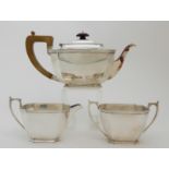 A THREE PIECE SILVER TEA SERVICE by Harrison Brothers & Howson (George Howson), Sheffield 1937, of