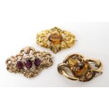 THREE VICTORIAN JEWELS a bright yellow metal brooch set with a citrine, with an engraved foliate