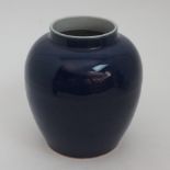 A CHINESE BLUE GROUND JAR incised with peonies and scrolling foliage, six character mark, 23cm