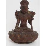 A CHINESE GILT BRONZE BODHISATTVA seated on lotus base, crossed legged, with right hand in varada