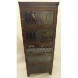 A MAHOGANY LEADED GLASS SECTIONAL BOOKCASE 175cm high x 61cm wide Estate of Alasdair Gray