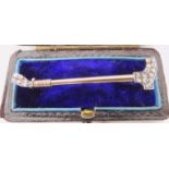 A DIAMOND SET RIDING CROP BROOCH in yellow and white metal, set with rose cut diamonds, length 4.
