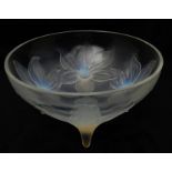 A RENE LALIQUE LYS BOWL with opalescent lily blossoms and raised on four stems, model 382, circa
