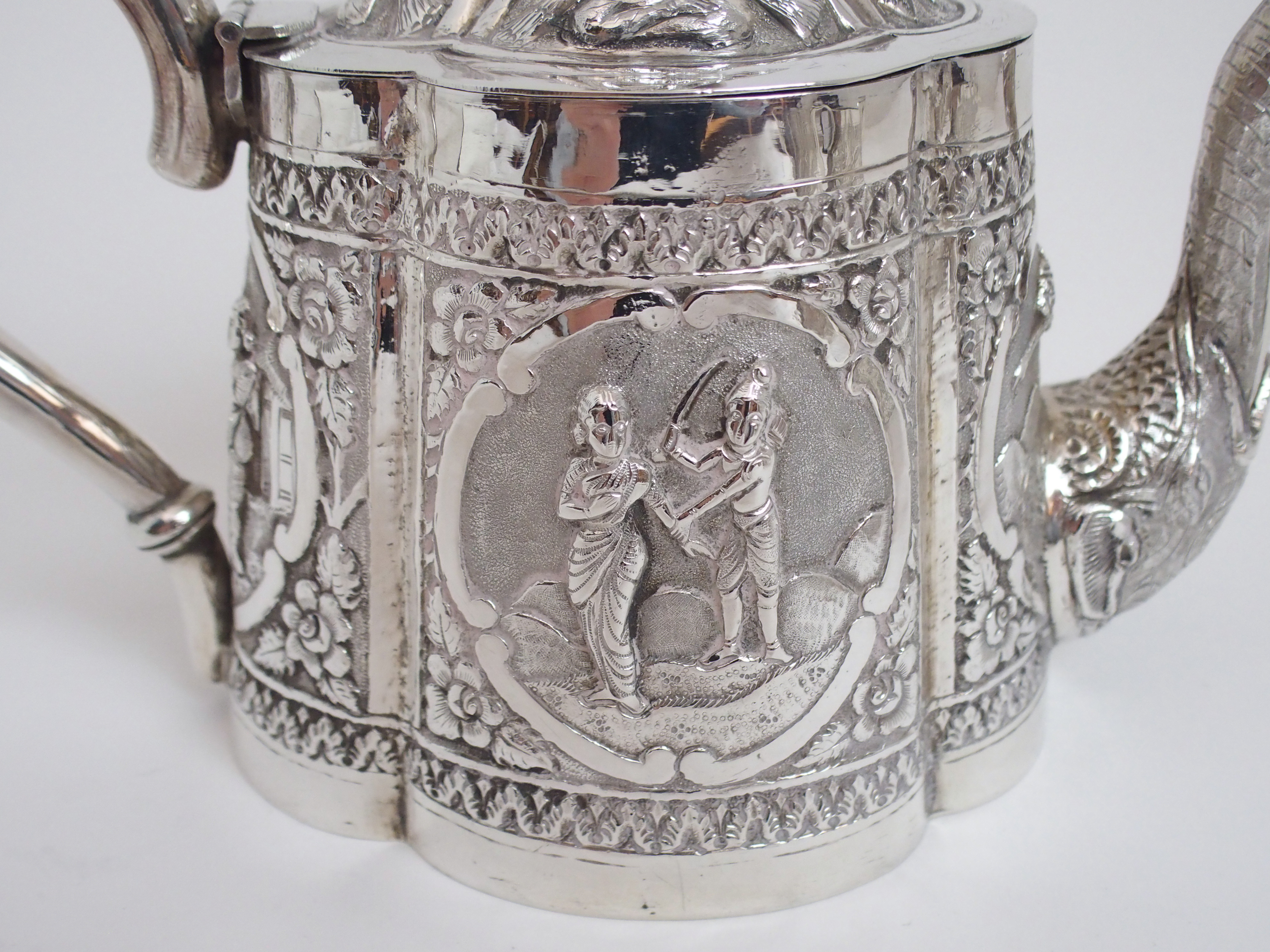 AN ASIAN WHITE METAL THREE PIECE TEA SERVICE cast and decorated with figures in cartouche panels - Image 3 of 13