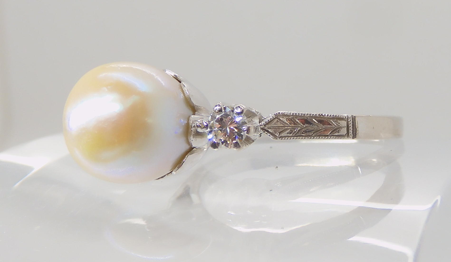 AN 18CT WHITE GOLD PEARL AND DIAMOND RING with wreath engraved shoulders, pearl approx 9mm in - Image 3 of 5