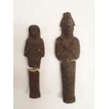 TWO EGYPTIAN SHABTI each holding crook and flail, 15 and 20cm high Condition Report: both broken