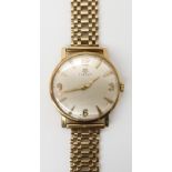 A 9CT GOLD GENTS TISSOT WRISTWATCH with gold coloured hands, Arabic and chevron numerals. Diameter