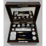 A VICTORIAN COROMANDEL TOILET BOX the interior fitted with silver topped jars and bottles by