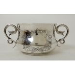 AN EDWARDIAN HAMMERED SILVER PORRINGER by Daniel & John Wellby, London 1906, the squat baluster