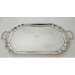A GEORGE VI SILVER TRAY by Barker Brothers Silver Limited, Birmingham 1939, of rectangular form with