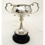 A SILVER TROPHY CUP by Walker and Hall, Sheffield 1934, of globular form with applied twin scrolling