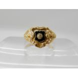 AN 18CT GOLD VICTORIAN MOURNING RING with black enamel and a rose cut diamond, hallmarked Birmingham