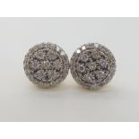 A PAIR OF 9CT GOLD DIAMOND CLUSTER EARRINGS set with estimated 1ct of brilliant cut diamonds in a