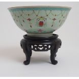 A CHINESE EXPORT BOWL painted with lanterns, joined by jewelled swags, within scrolling foliage
