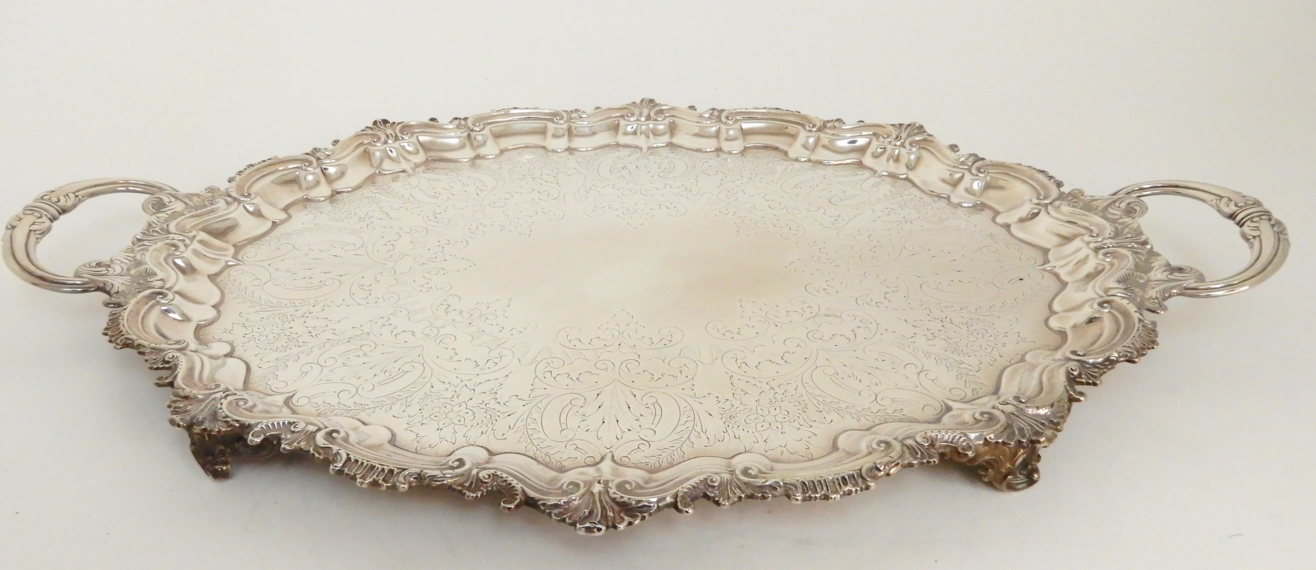 AN EDWARDIAN SILVER TWIN HANDLED SERVING TRAY by Barker Brothers, Birmingham 1901, of oval form, the