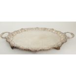 AN EDWARDIAN SILVER TWIN HANDLED SERVING TRAY by Barker Brothers, Birmingham 1901, of oval form, the