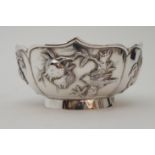 A CHINESE SILVER LOBED SUGAR BOWL decorated with panels of birds amongst fruit trees and foliage,