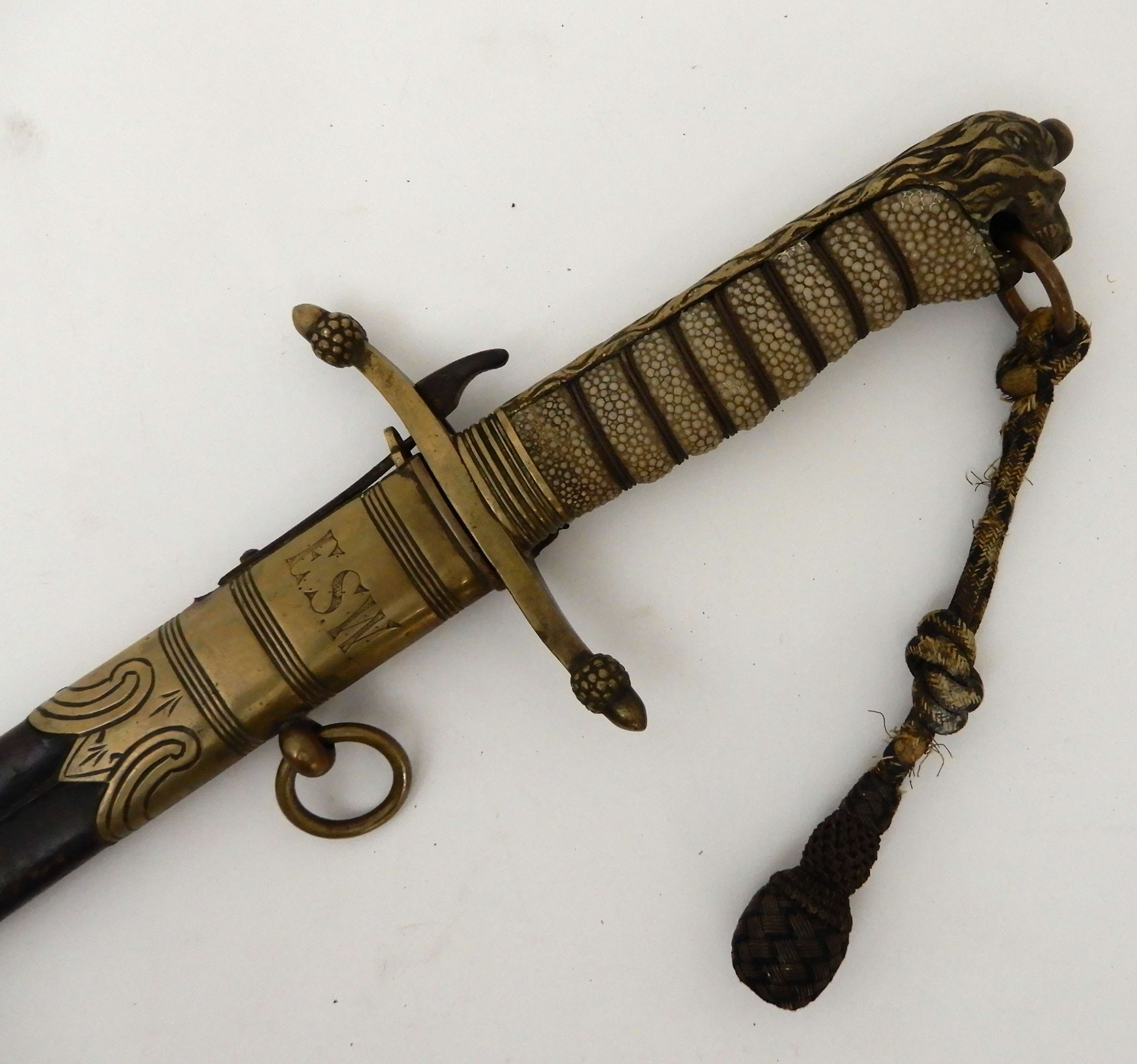 A BRITISH ROYAL NAVY MIDSHIPMAN'S DAGGER the sharkskin wire wound hilt with lion's head pommel,