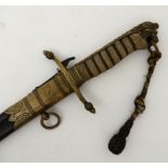 A BRITISH ROYAL NAVY MIDSHIPMAN'S DAGGER the sharkskin wire wound hilt with lion's head pommel,