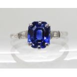 AN 18CT AND PLATINUM SAPPHIRE AND DIAMOND RING of classic Art Deco design with baguette cut diamonds