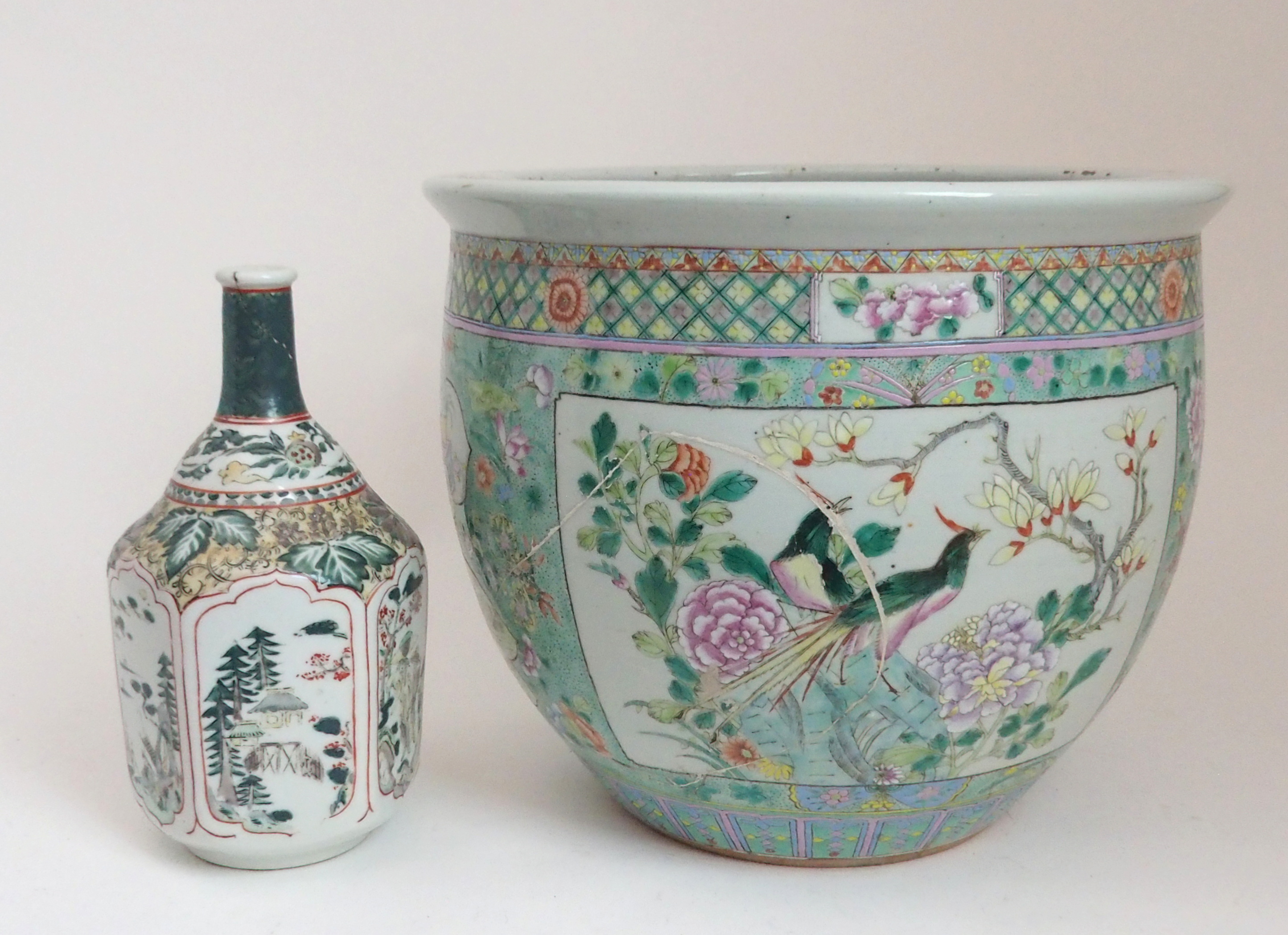 A CHINESE FAMILLE VERTE FISH BOWL painted with panels of birds amongst foliage and rockwork,