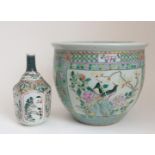 A CHINESE FAMILLE VERTE FISH BOWL painted with panels of birds amongst foliage and rockwork,